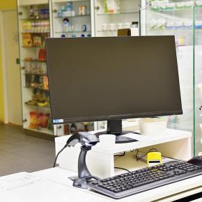 Computers and monitors at the cash register pharmacy